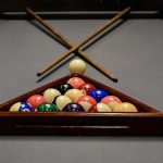billiard table cue balls by marcelo leal unsplash